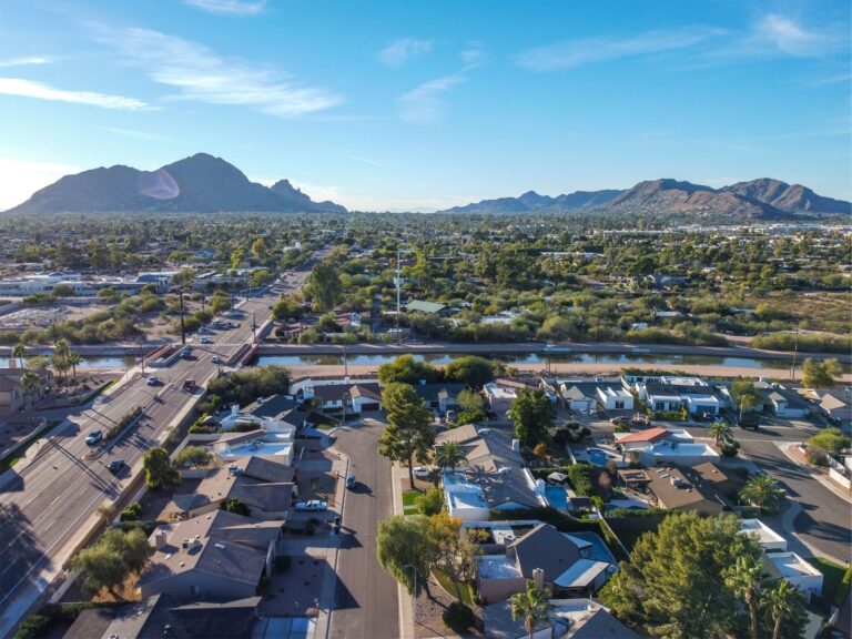 a small neighborhood with a mountain in the background